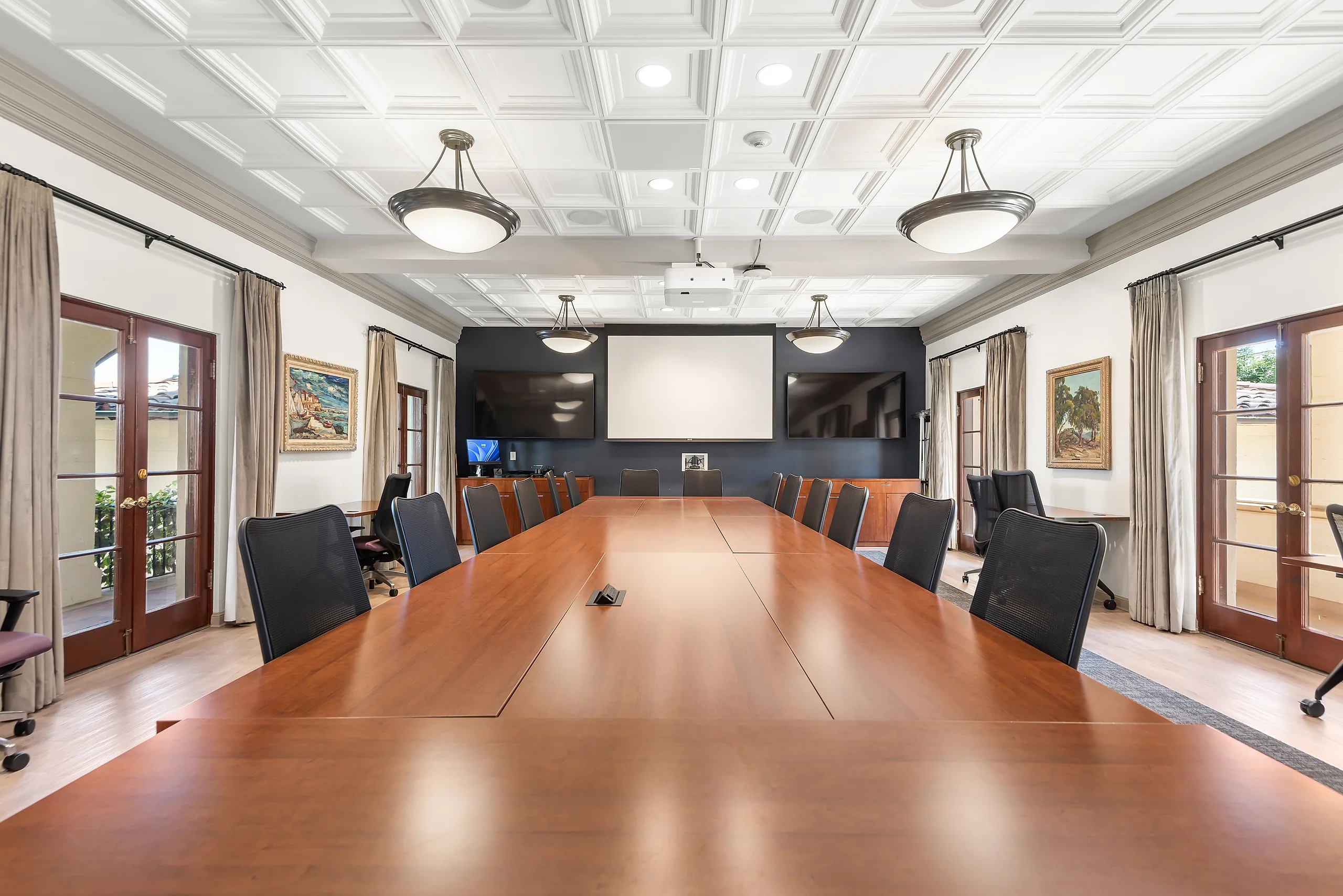 Boardroom with a long conference table inside Hannon Parlor at Chalon Campus