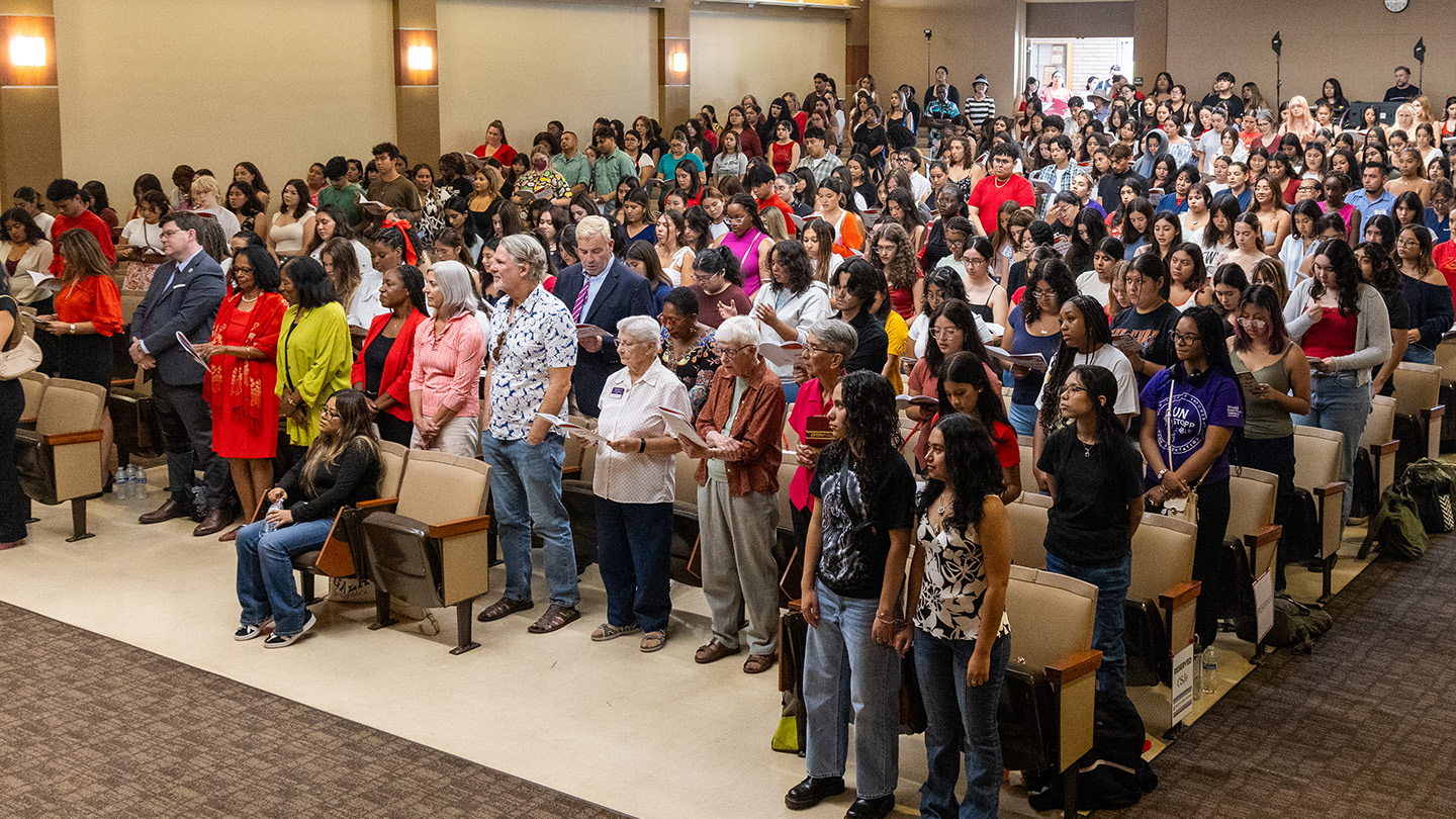 A university gathering inside Rose Hills Auditorium at Doheny Campus