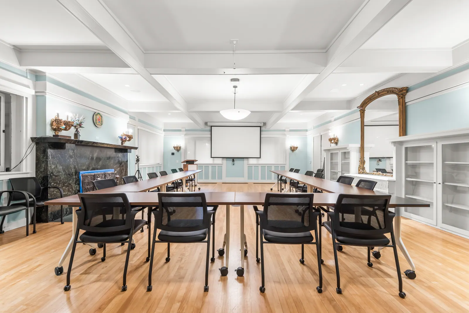 Meeting tables inside the first-floor conference rooms of the historic Amat House