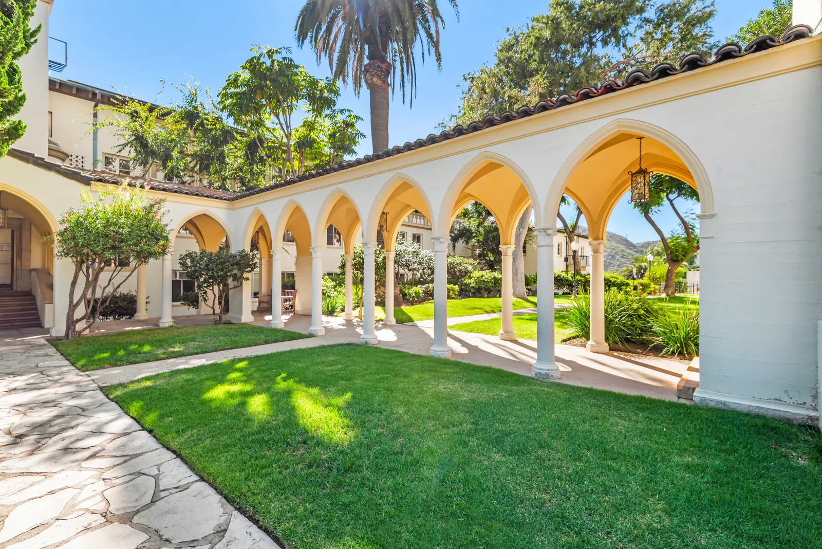 The open lawn and arched colonnade beside Brady Hall at Chalon Campus